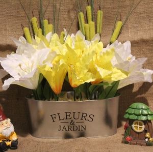 Homemade garden tub with artificial flowers